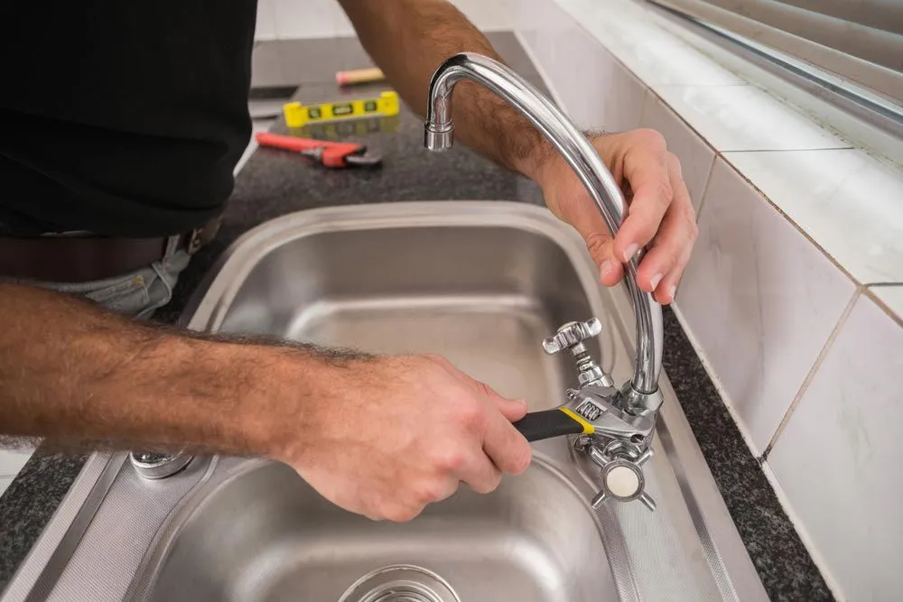 plumber replacing a tap 1920w
